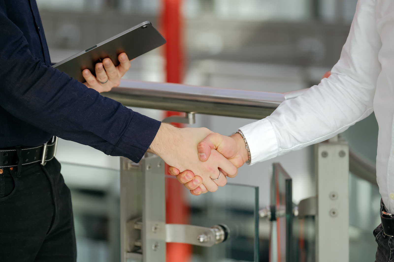 The handshake between the two studios, up close