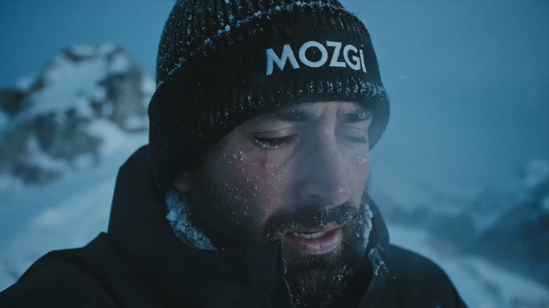 The brand object — the beanie that survives the storm