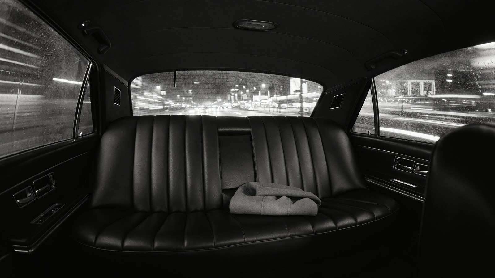 Back-seat plate — a folded coat where she would sit