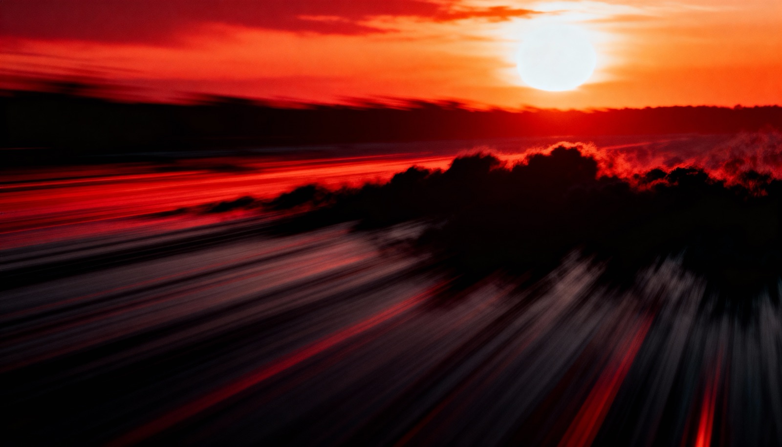 Fire-red motion blur — speed as pure color